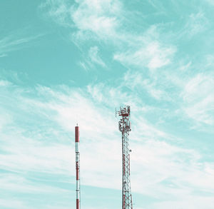 Low angle view of communications tower against sky