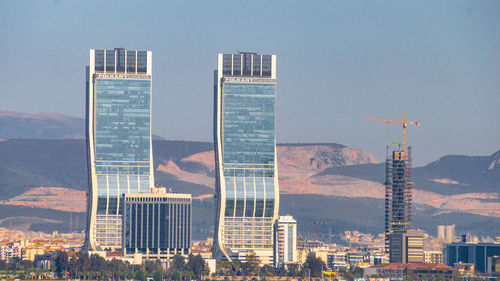 Buildings in city against sky