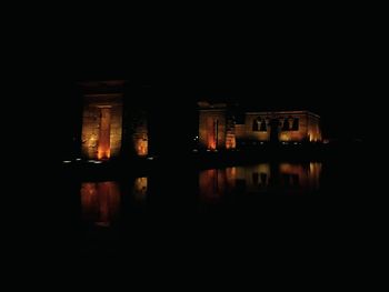 Reflection of illuminated buildings in water at night