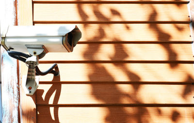 Close-up of electric lamp on wall