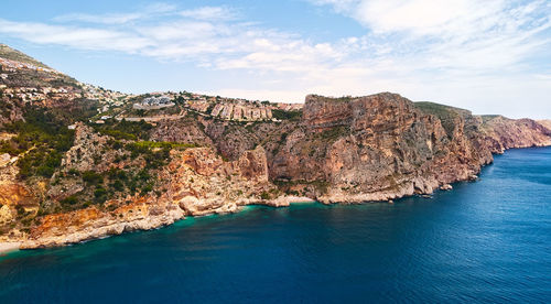 Scenic view of bay against sky