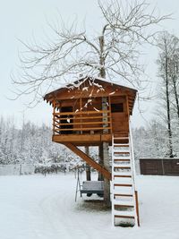 Built structure on snow covered field