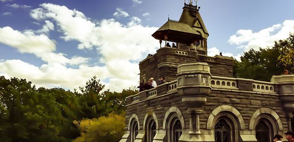 Low angle view of temple against cloudy sky