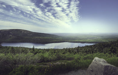 Scenic view of landscape and mountains against sky