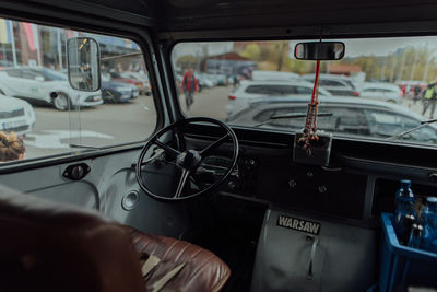 Cropped hand of man driving car