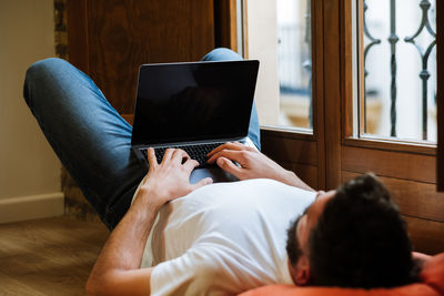 Freelancer using laptop at home