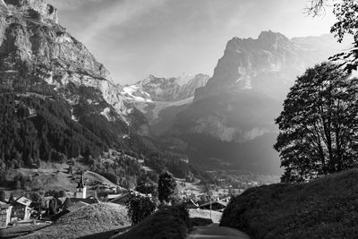 Scenic view of mountains against cloudy sky