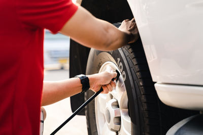 High angle view of man repairing car