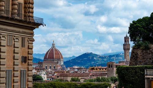 Buildings in city against sky