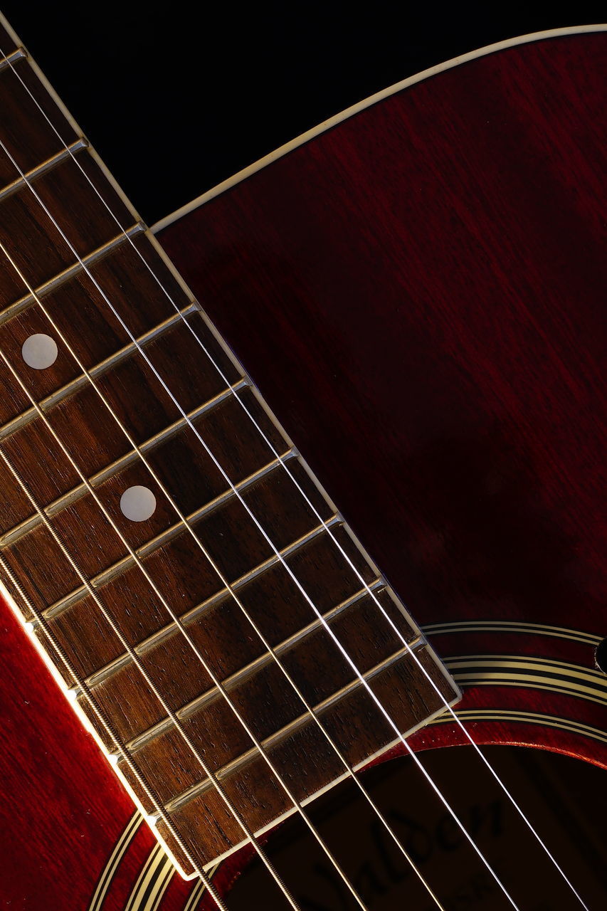 CLOSE-UP OF GUITAR IN OFFICE