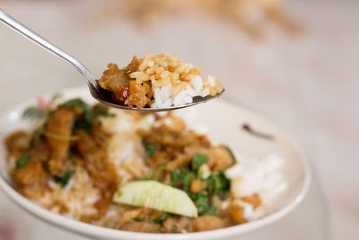 Close-up of cooked rice in spoon