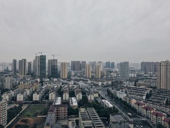 Aerial view of cityscape against sky