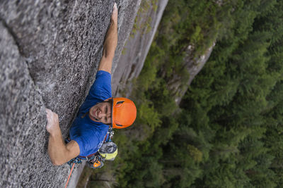 Climber smiling while trad climbing multipitch route in squamish