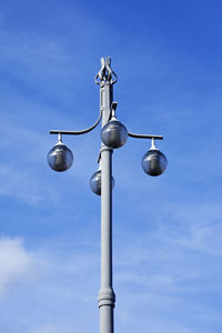 Low angle view of street light against clear blue sky