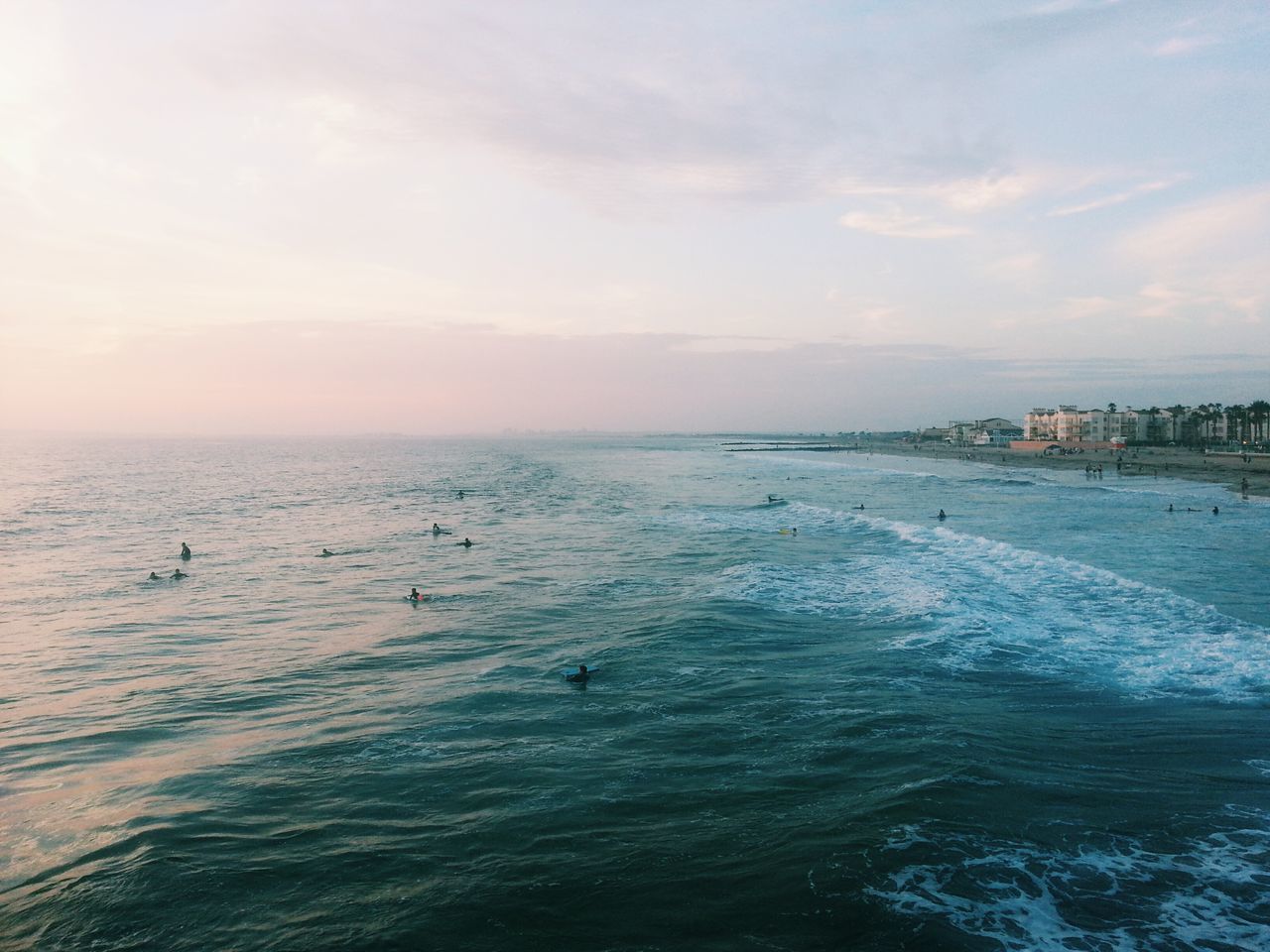 sea, water, sky, beach, horizon over water, scenics, tranquil scene, beauty in nature, tranquility, nature, waterfront, shore, cloud - sky, wave, idyllic, sand, incidental people, sunset, outdoors, rippled