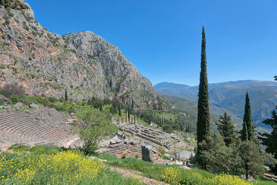 Scenic view of mountains against clear blue sky