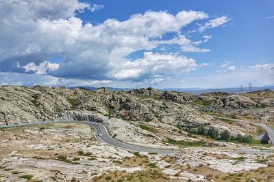 Scenic view of mountain road against sky