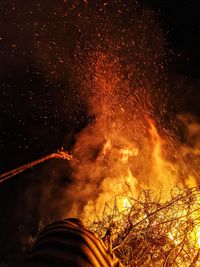 Low angle view of firework display at night