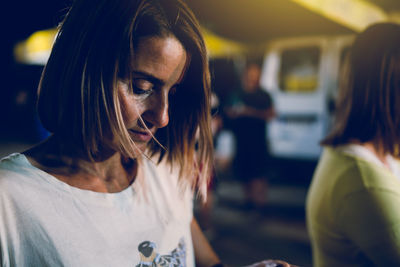 Close-up of woman looking at camera