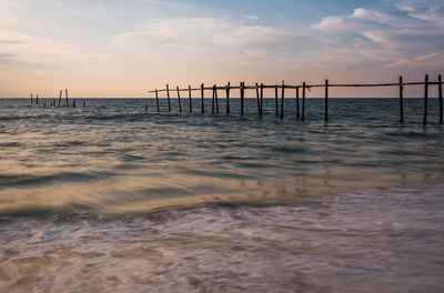 Pier over sea against sky