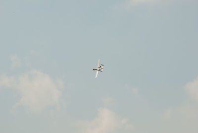 Low angle view of airplane flying in sky