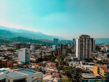 High angle view of buildings in city against sky