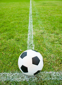 Close-up of soccer ball on playing field