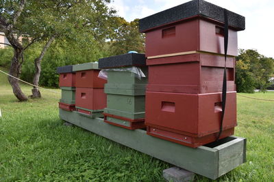 Low view of beehives on field