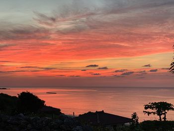 Scenic view of sea against orange sky