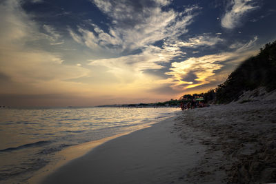 Scenic view of beach against sky during sunset