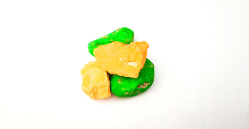 High angle view of green pepper against white background