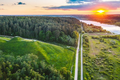 Scenic view of land against sky during sunset