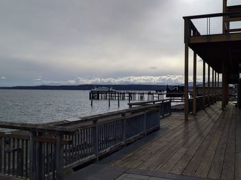 Pier over sea against sky