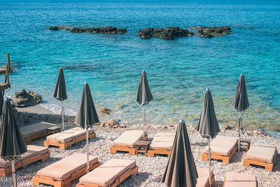 High angle view of deck chairs on shore