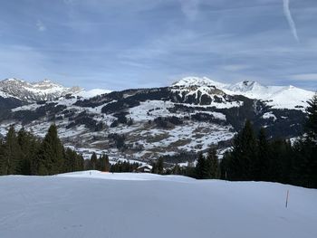 Scenic view of snowcapped mountains against sky