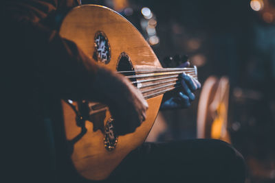 Man playing guitar at cafe