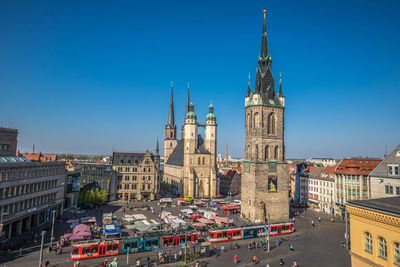 Panoramic view of buildings in city against clear sky