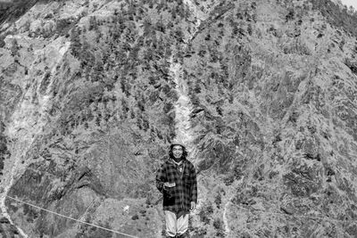 Portrait of young man standing outdoors