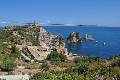 Scenic view of sea against clear blue sky