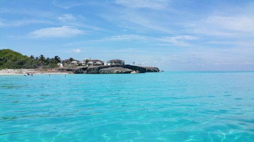 Scenic view of sea against blue sky