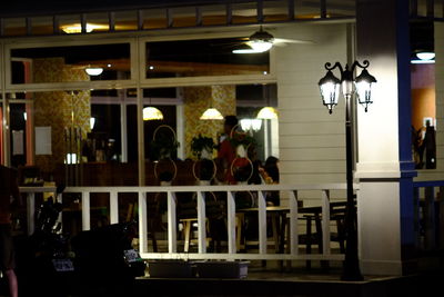 People in illuminated room