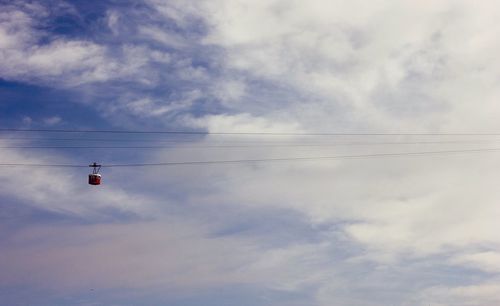 Low angle view of cables against sky
