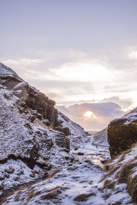 Scenic view of mountains against sky during winter
