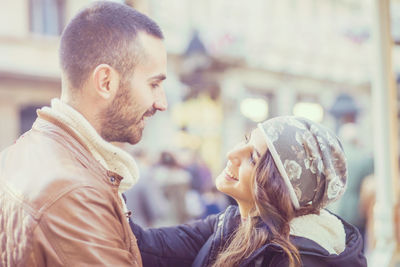  side view of couple facing each other