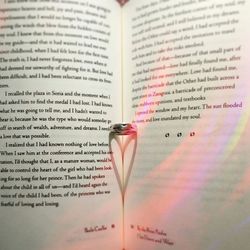 Close-up of pen on book