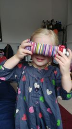 Midsection of cute girl standing at home