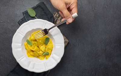 Closeup of tasty appetizing ravioli white plate