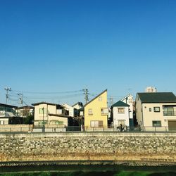 Buildings against blue sky and clouds