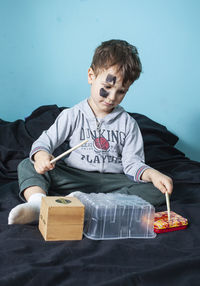 Full length of a boy holding food