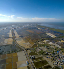 Aerial view of agricultural landscape against sky